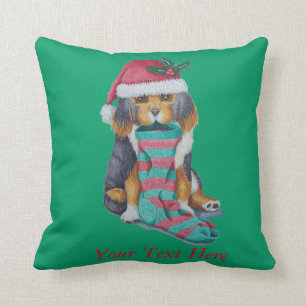 cute black and brown puppy with christmas stocking cushion