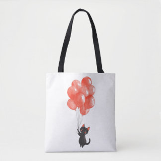 Cute black kitten holds a bunch of red balloons tote bag