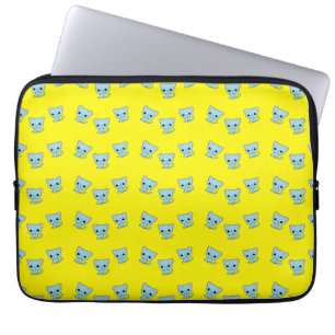 Cute bouncy blue kitten on yellow laptop sleeve