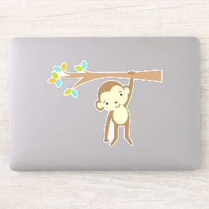Cute Brown Monkey Hanging from a Branch