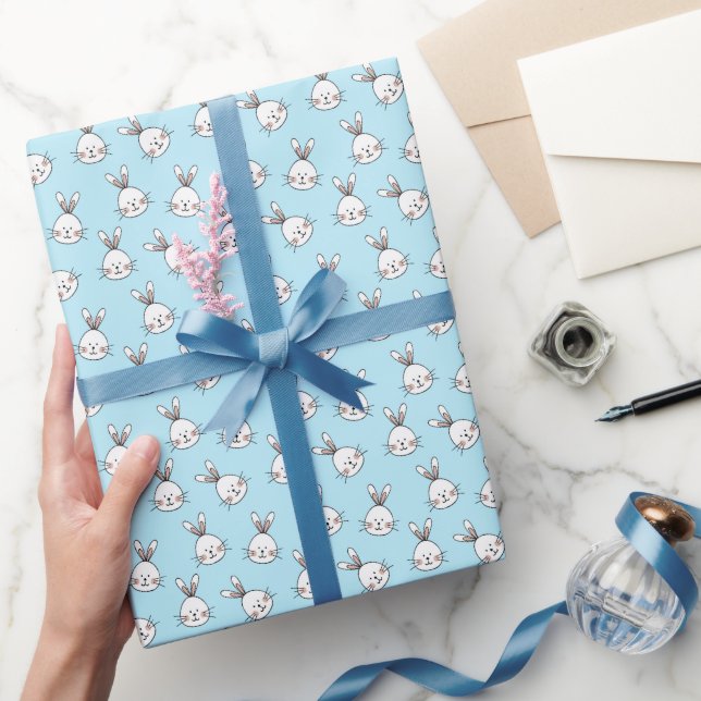 Cute bunny face pattern on light blue wrapping paper (Gifting)