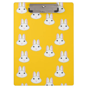 Cute bunny faces on orange clipboard