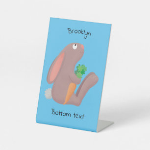 Cute bunny rabbit sitting with carrot cartoon pedestal sign