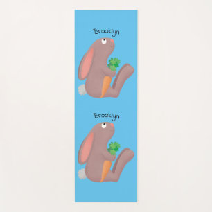 Cute bunny rabbit sitting with carrot cartoon yoga mat