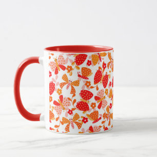 Cute butterfly in a flower garden in red orange mug