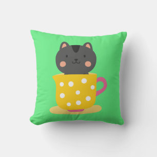 Cute cat in teacup cartoon on mint cushion