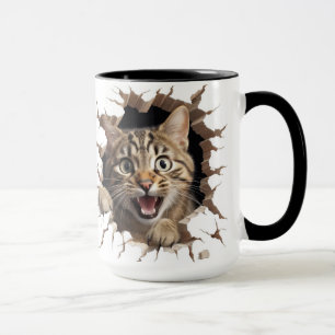 cute cat looking out from a wall mug