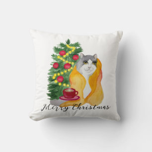 Cute cat under a cosy blanket with a cup of tea cushion