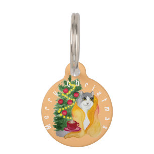 Cute cat under a cosy blanket with a cup of tea pet tag