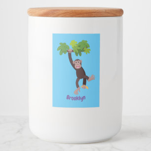 Cute chimpanzee in jungle hanging cartoon food label