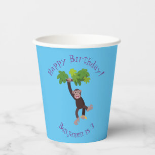 Cute chimpanzee in jungle hanging cartoon paper cups
