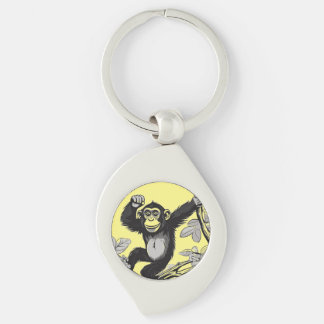 Cute chimpanzee on the branch greets key ring
