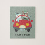 Cute Christmas Bear Snowman Red Car Custom Name Jigsaw Puzzle<br><div class="desc">Delight in the holiday season with this cute and colourful custom puzzle, featuring a whimsical winter illustration of an adorable bear and snowman driving a red car. Personalise it with your name in a retro typewriter font to make it uniquely yours. This charming puzzle is a great gift idea for...</div>