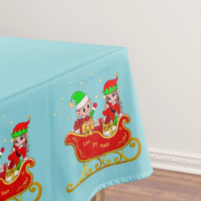 Cute Christmas elves on sleigh on light blue Tablecloth (In Situ)