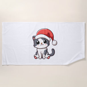 Cute Christmas kitten wearing Santa hat Beach Towel