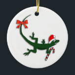 Cute Christmas Lizard Holiday Ornament<br><div class="desc">This cute little green lizard is ready for Christmas with his Santa hat and candy cane and a bright red ribbon.</div>