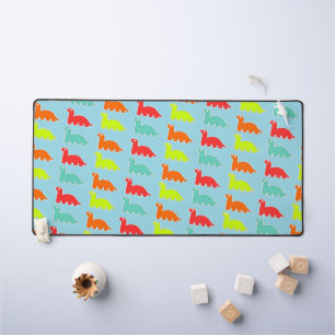 Cute colourful dinos on blue desk mat