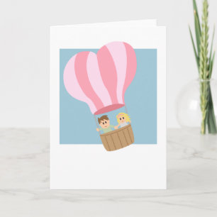 Cute couple in hot air balloon holiday card