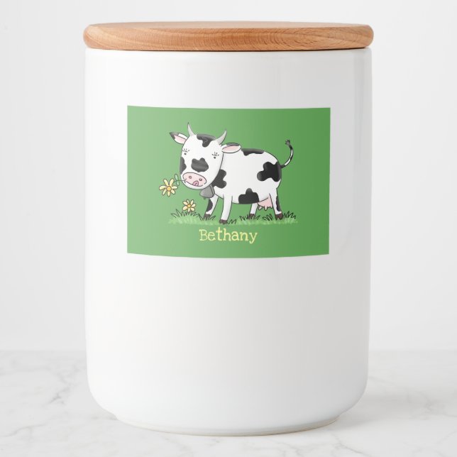 Cute cow in green field cartoon illustration food label (Front)