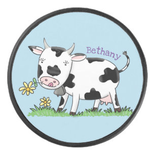 Cute cow in green field cartoon illustration hockey puck