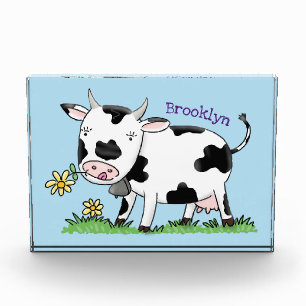 Cute cow in green field cartoon illustration photo block