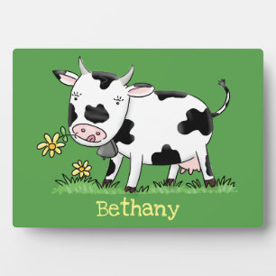 Cute cow in green field cartoon illustration plaque