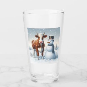 Cute cow & snowman in the winter field glass