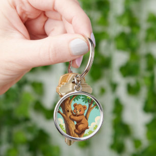 Cute cub bear climbing a tree key ring