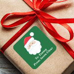 Cute Custom From Santa Claus Green Christmas Gift Square Sticker<br><div class="desc">Customise these cute Santa Claus gift labels with your own personalised text with your kids name in white script. Santa's red hat and white beard are the perfect holiday drawing on this festive green square gift sticker for your presents.</div>