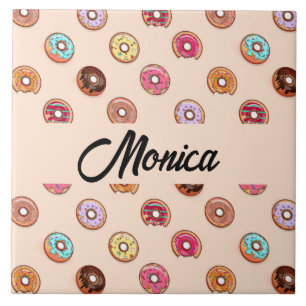 Cute decorative doughnuts on pink tile