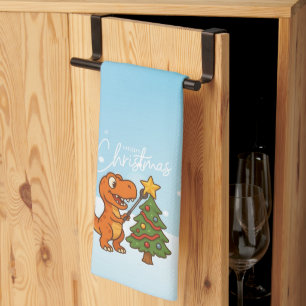 Cute dinosaur with Christmas tree Tea Towel