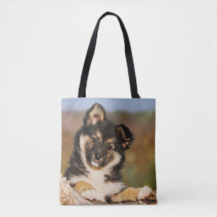Cute Dog Icelandic Sheepdog Puppy at a Tree Trunk Tote Bag