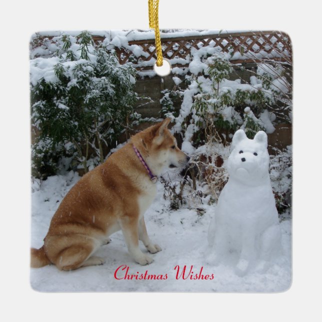 cute dog sitting with snowman at christmas ceramic ornament (Front)