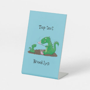 Cute dragons roasting marshmallows cartoon pedestal sign