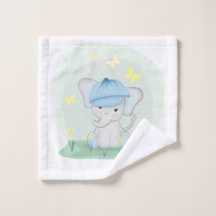 Cute elephant in a flower meadow. wash cloth