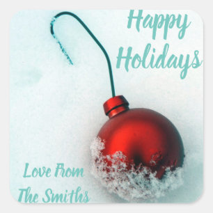 Cute festive red ornament on snow holiday photo square sticker