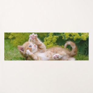 Cute funny cat kitten playing in a flowery garden  yoga mat