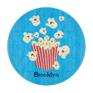 Cute funny jumping popcorn cartoon cutting board
