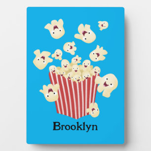 Cute funny jumping popcorn cartoon plaque