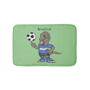 Cute funny Komodo dragon playing soccer cartoon Bath Mat