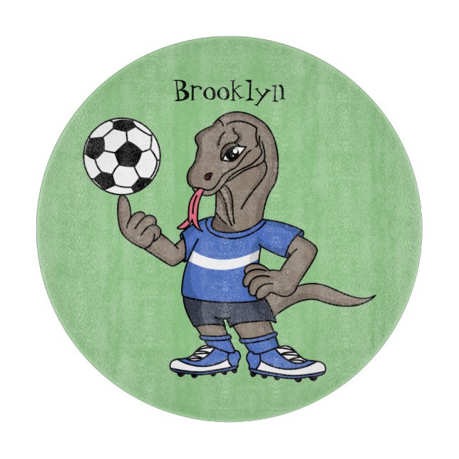 Cute funny Komodo dragon playing soccer cartoon  Cutting Board (Front)