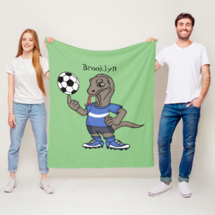 Cute funny Komodo dragon playing soccer cartoon Fleece Blanket