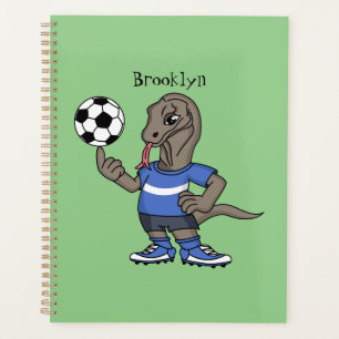 Cute funny Komodo dragon playing soccer cartoon Planner