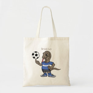 Cute funny Komodo dragon playing soccer cartoon Tote Bag