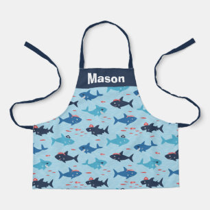 Cute funny sharks with pirate hats on blue apron