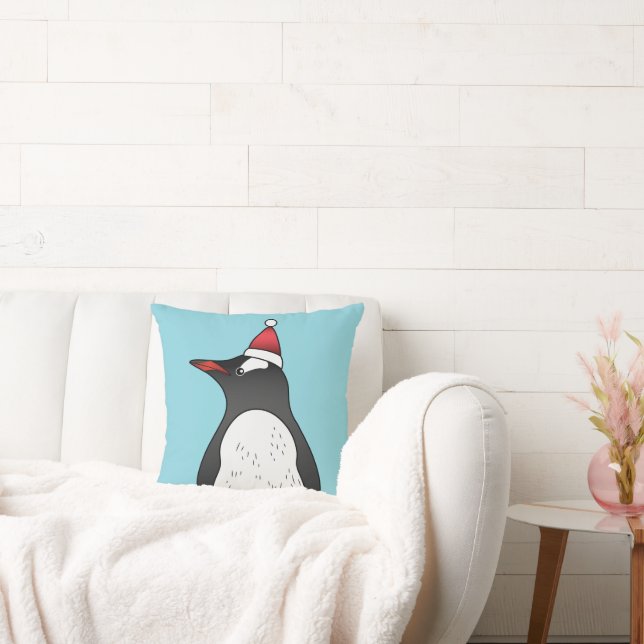 Cute Gentoo Penguin Wearing A Santa Hat On Blue Cushion (Couch)