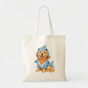 Cute golden retriever dog in blue shark costume tote bag