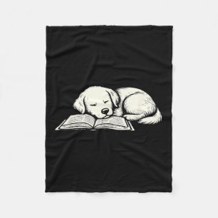 Cute golden retriever dog sleeping on book reader fleece blanket