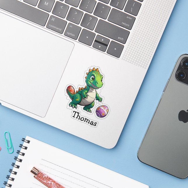 Cute green dinosaur with Easter eggs (Laptop w/ iPhone)