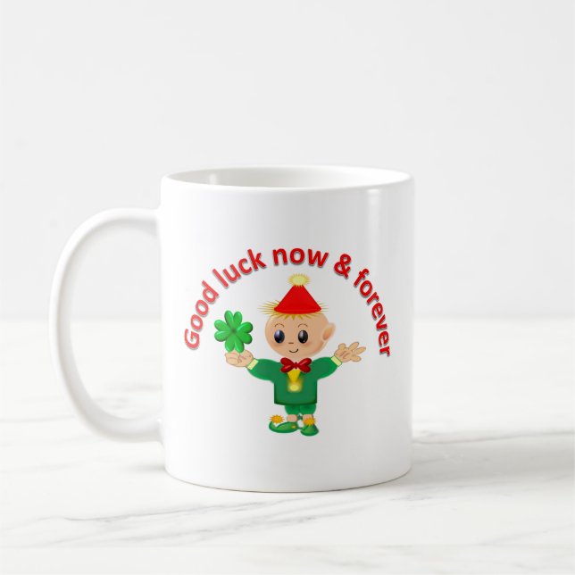 Cute green elf holding a shamrock coffee mug (Left)